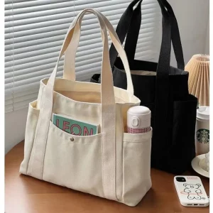 Buy Large Capacity Canvas Tote Bags for Work Commuting Carrying Bag College Style Student Outfit Book Shoulder Bag Shopping Bag in Ghana.
